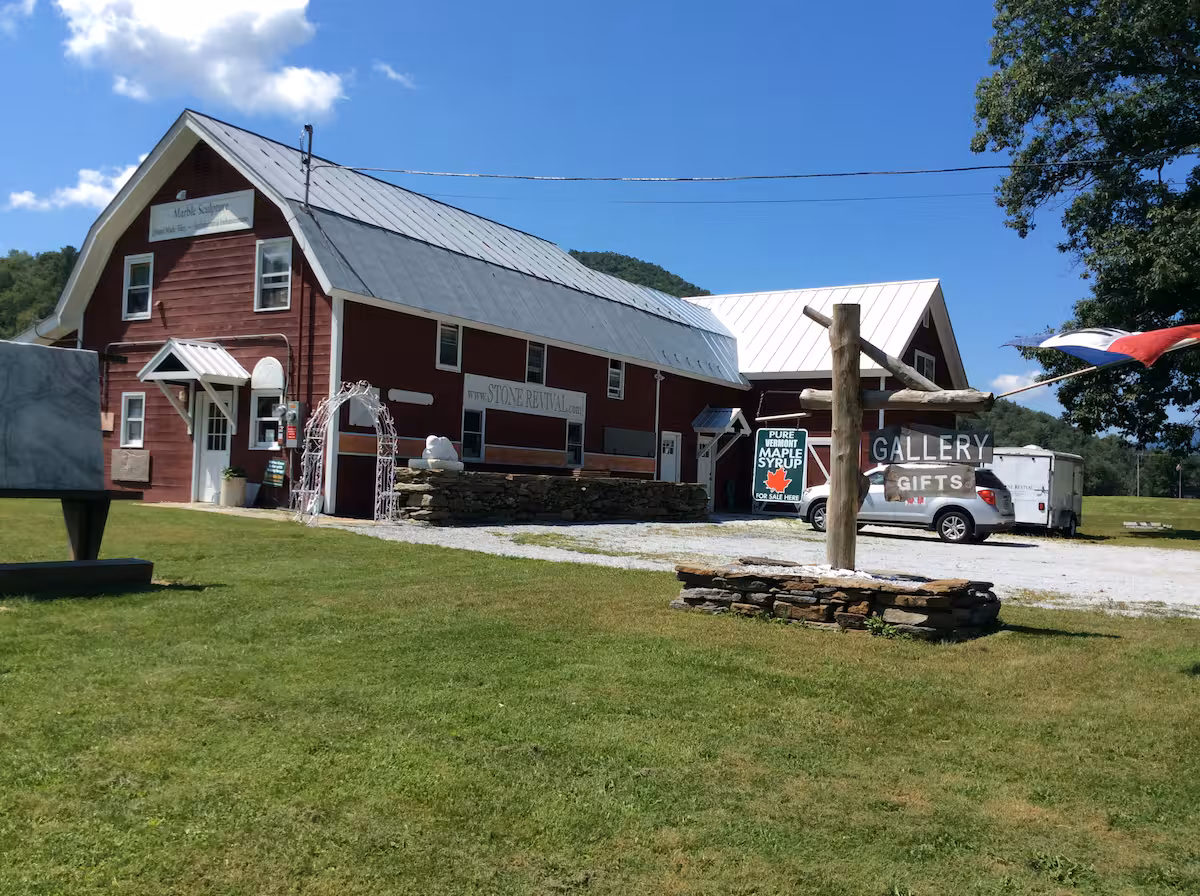 A redbarn in Vermont that is home to Stone Revival Gallery and Gift shop. Inventory includes custom sculptures, including memorials, marble, hardwood, and functional art.